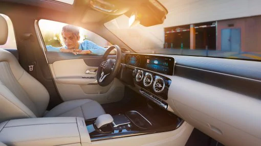 The image shows the cockpit with steering wheel in the A-Class.